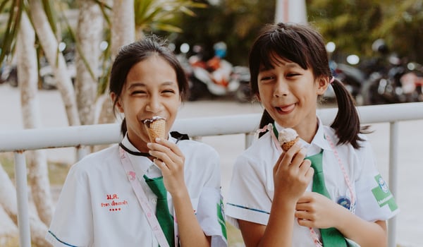 Why do Thai people often laugh when foreigners speak Thai?